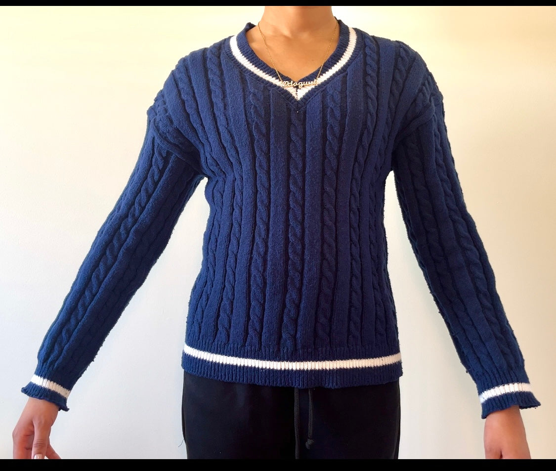 Navy blue cable-knit sweater