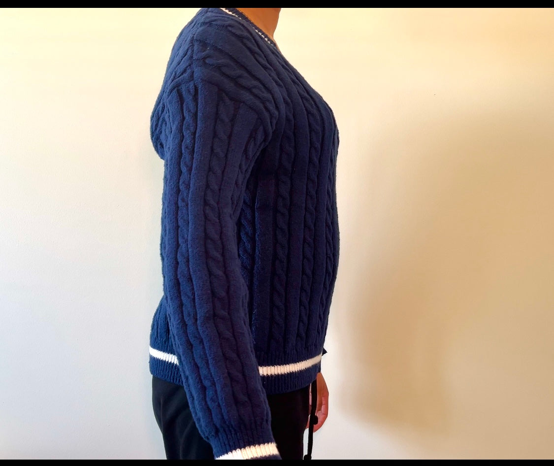 Navy blue cable-knit sweater