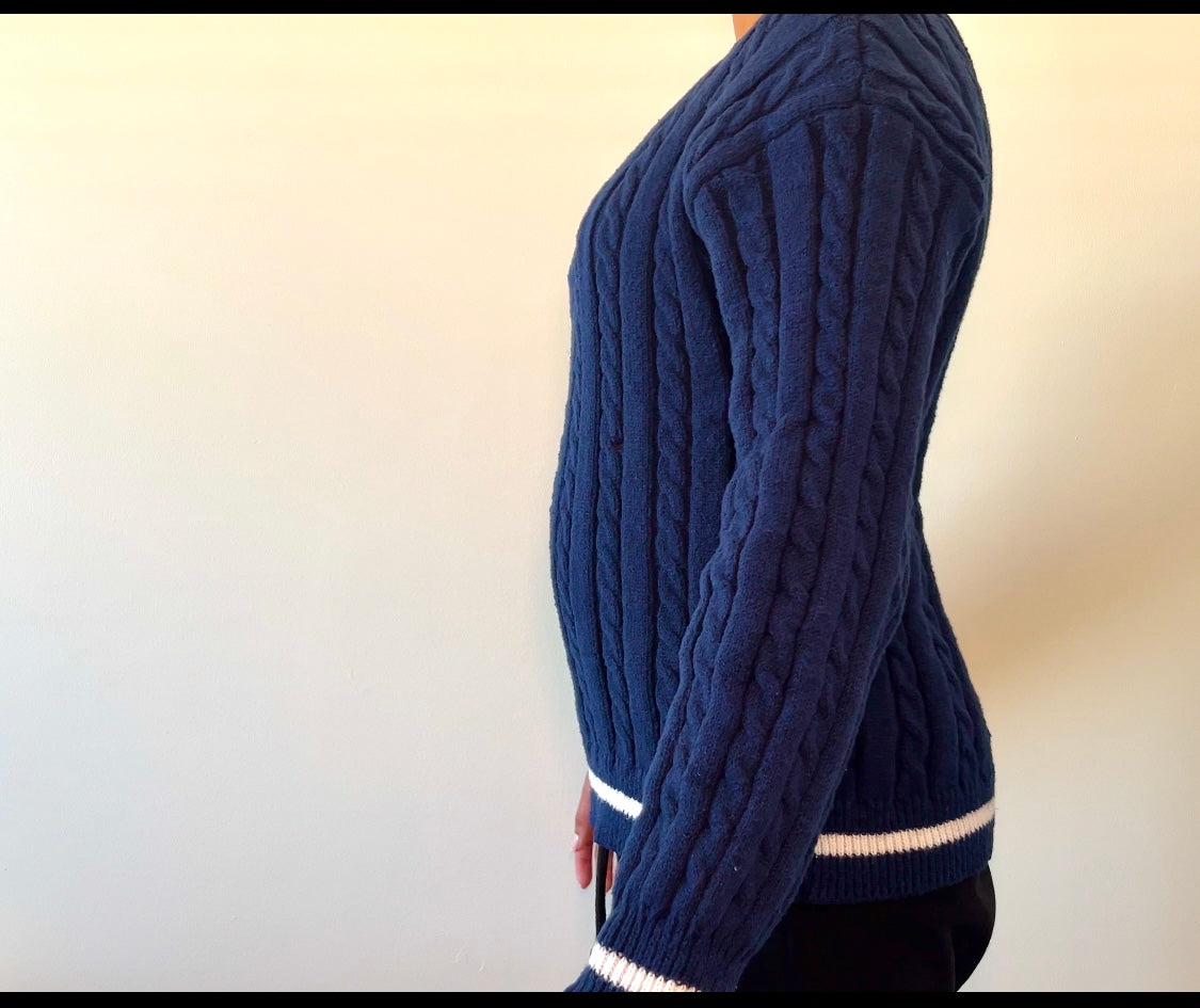 Navy blue cable-knit sweater